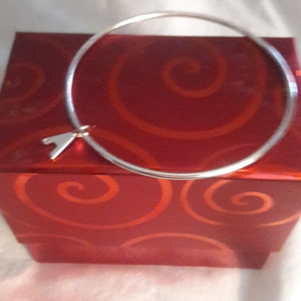 Silver bangle bracelet .
